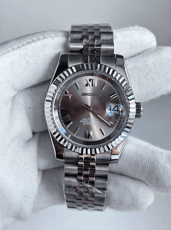 grey Roman dial stainless steel Seiko NH35 mod watch on jubilee bracelet, anlge shot