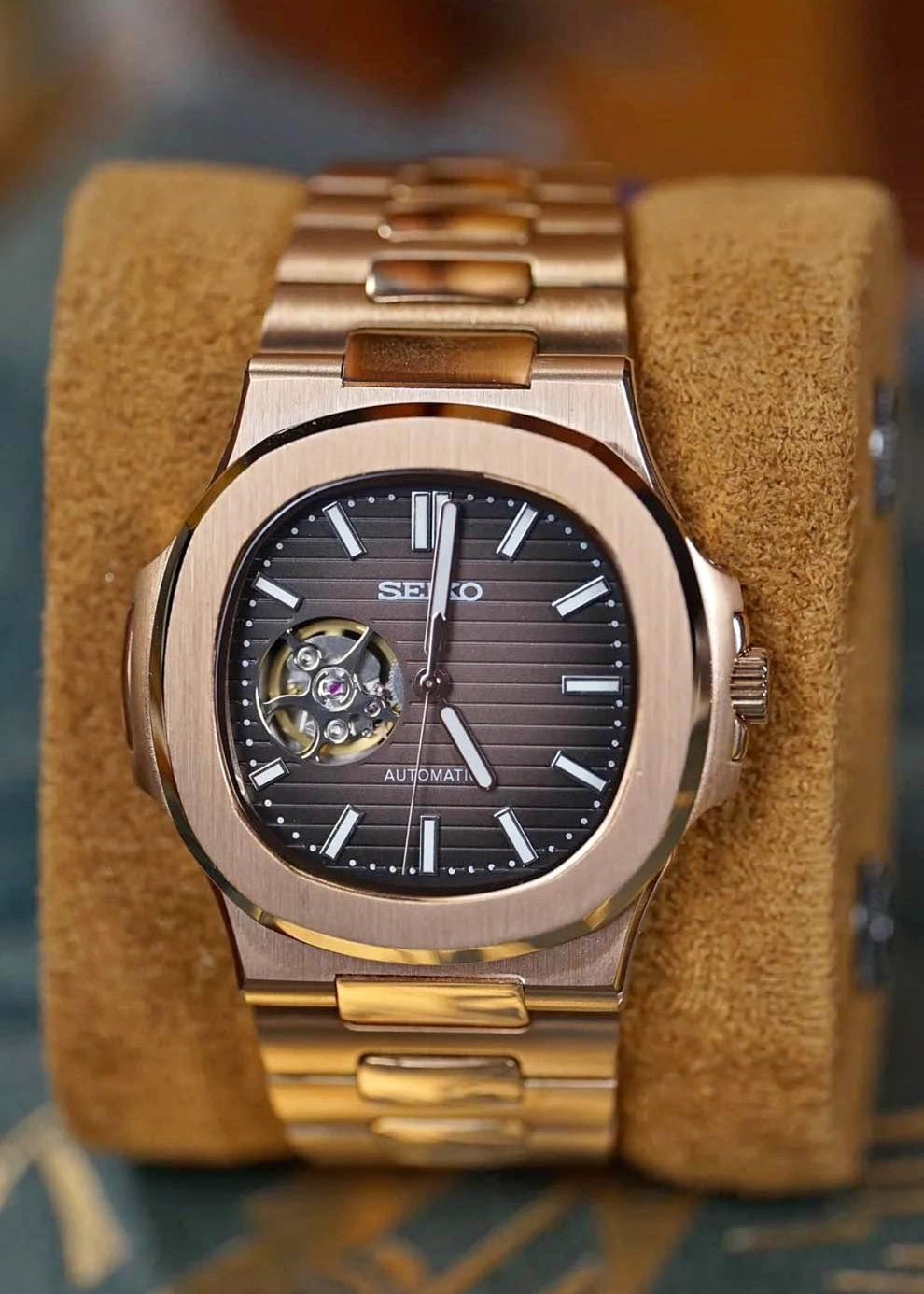 Seiko mod nautiko rose gold open heart watch with brown striped dial