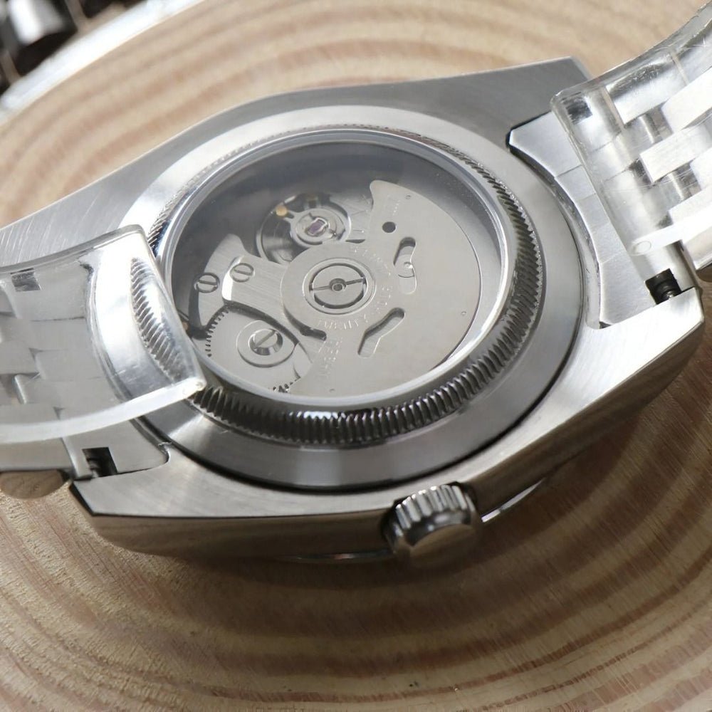 exhibition caseback of white Roman dial stainless steel Seiko NH35 mod watch, movement visible
