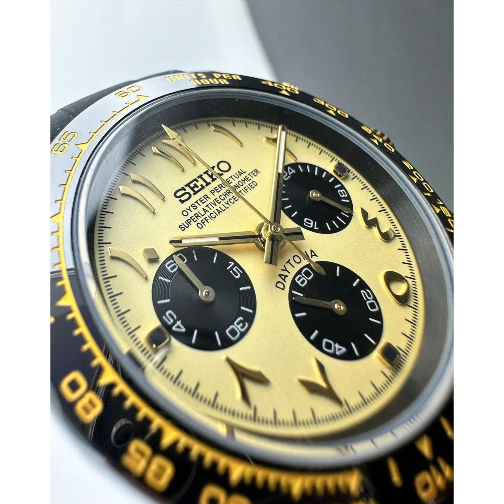 Yellow Arabic Seiktona VK63 chronograph on black strap wrist shot