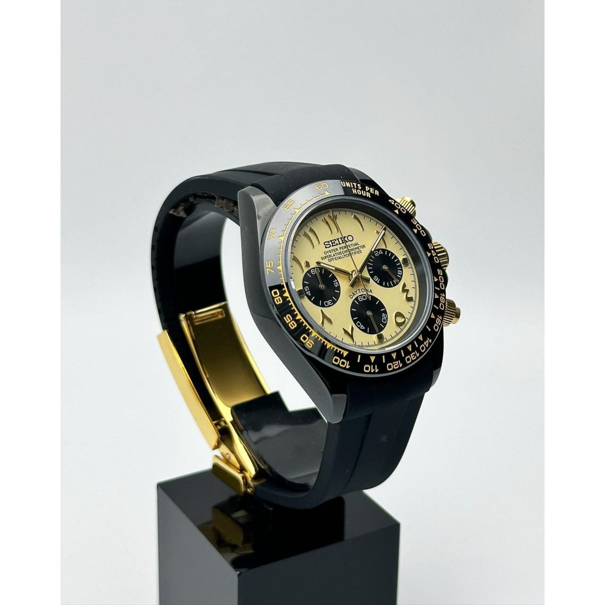 black and gold Seiktona chronograph side profile showing pushers and crown