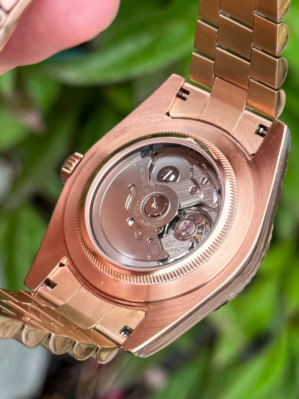 rose gold Seiko NH35 mod with brown Arabic dial, close-up