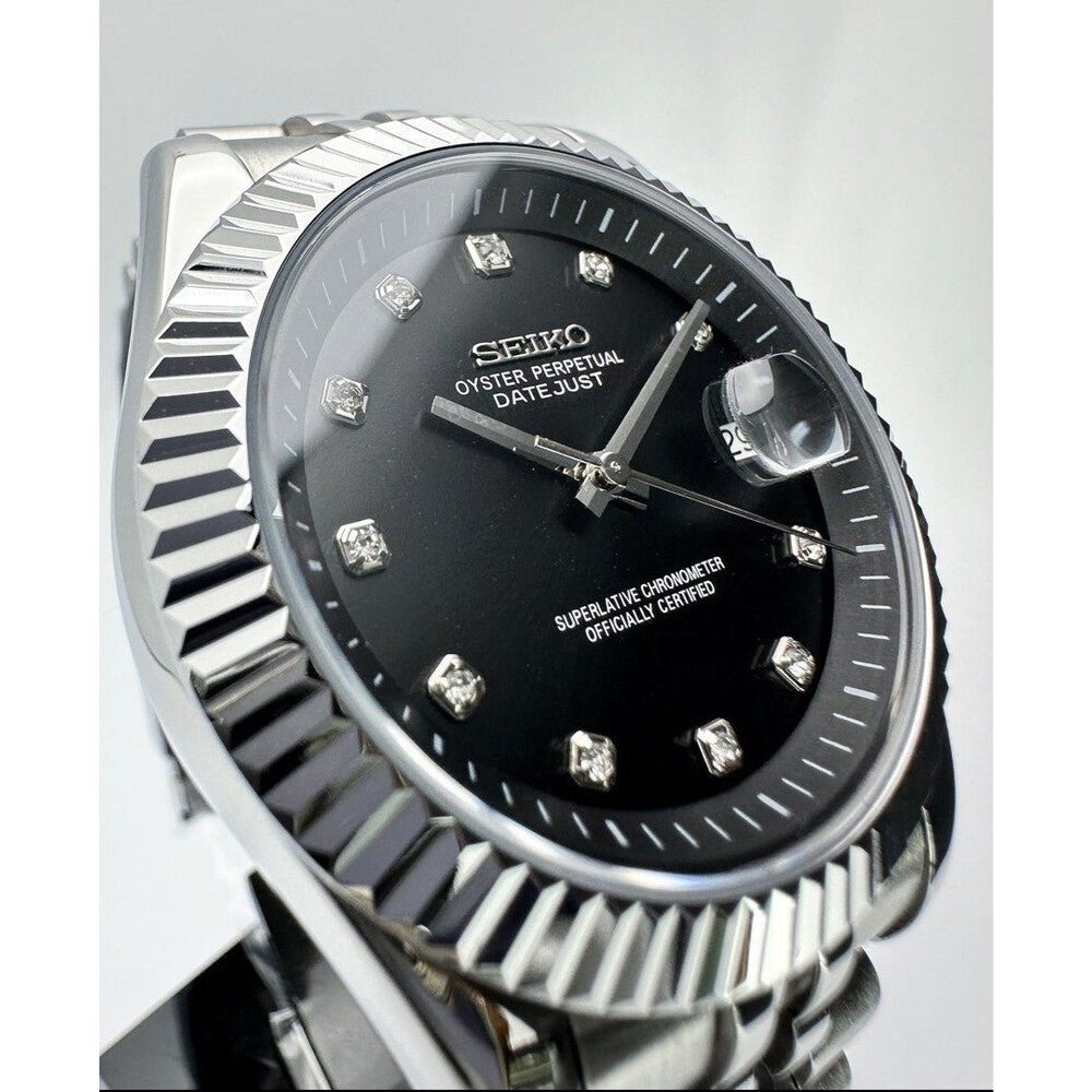 black diamond index Seiko mod automatic watch with stainless steel bracelet, dial shot