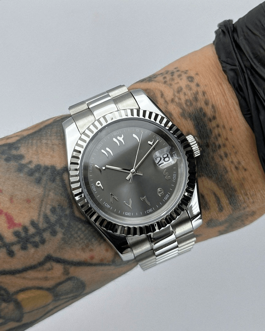 stainless steel Seiko NH35 mod with Wimbledon Arabic dial, close-up on wrist